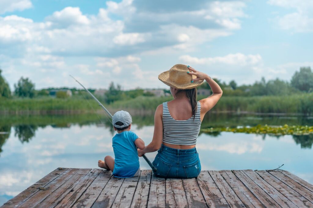 a woman and a child fishing together