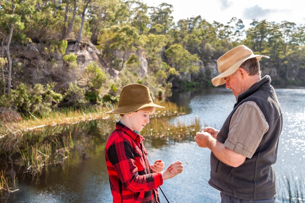 father and son preparing bait for fishing